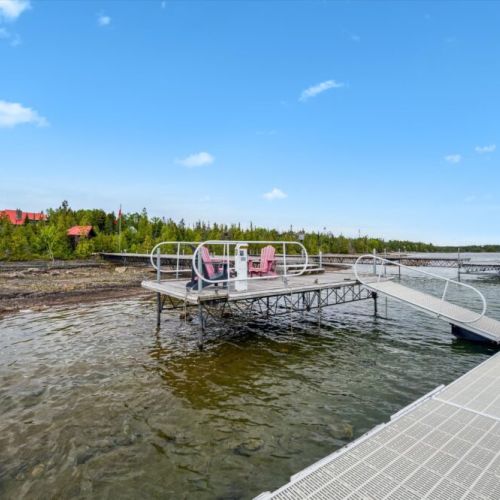 The 100-ft dock includes a floating platform with seating, 30-amp power for boats up to 40 ft, and space for jet skis and paddleboards. Waterfront living doesn’t get better than this.