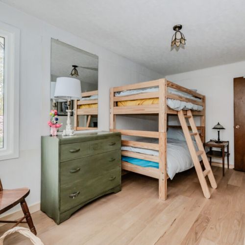 Perfect for families or groups, this room features bunk beds and playful decor, making it an ideal space for children or additional guests.