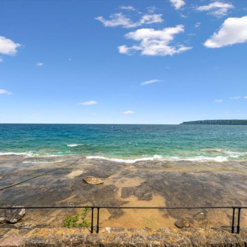 Flat rock ledges meet crystal-clear water for sunbathing and swims.