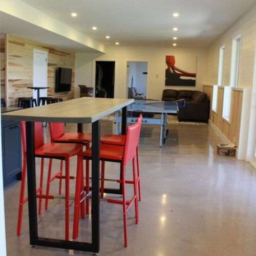The lower level lounge with kitchenette and smart TV.