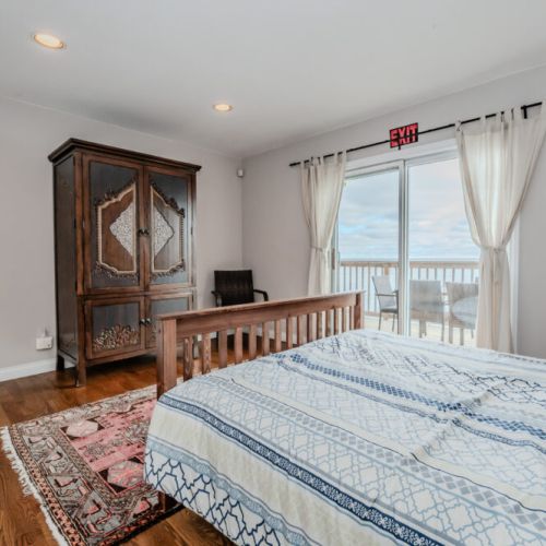 Enjoy the comfort of the ground-level primary suite, featuring direct deck access and stunning bay views. Start your day with morning coffee on the deck, taking in the serene waters of Georgian Bay and the peaceful ambiance of the Bruce Peninsula.