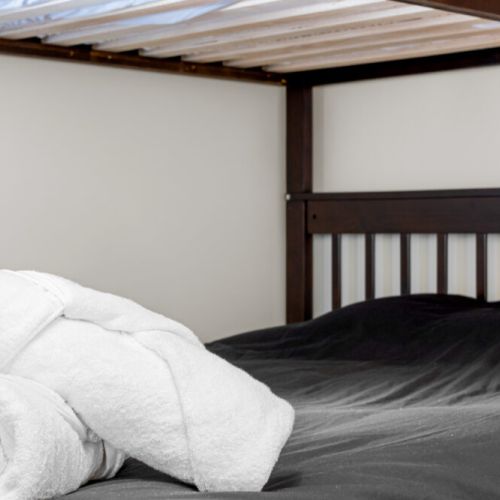 A cozy bunk bed offers a fun and comfortable sleeping space for kids or extra guests.