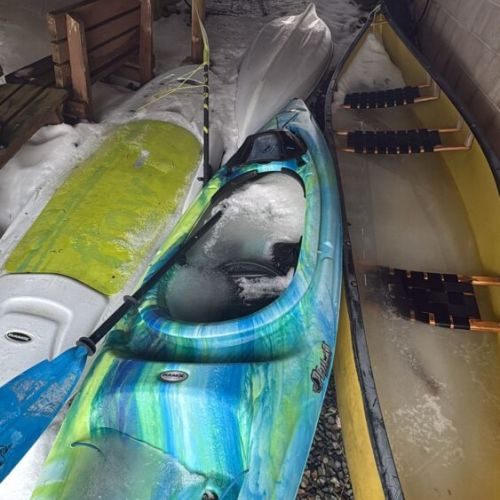 Colorful kayaks ready for your next Lake Huron adventure—explore the shoreline at your own pace.