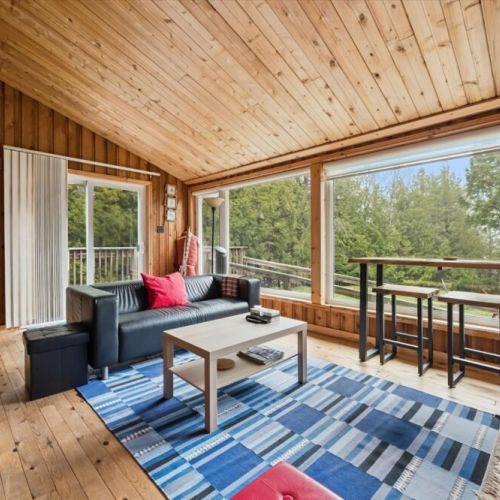 Large windows frame beautiful lake views, bringing the outdoors right into the living space.