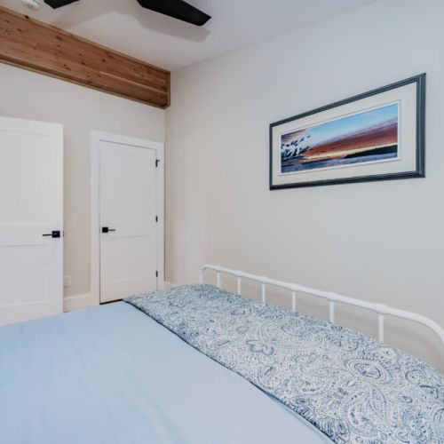 Cozy and peaceful guest bedroom with a modern farmhouse vibe, perfect for a relaxing stay at this serene vacation rental near nature trails and lakeside adventures.