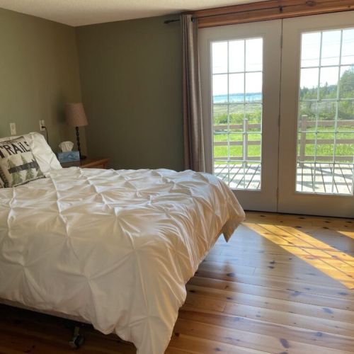 Bedroom 1: Wake up to natural light and peaceful outdoor views
