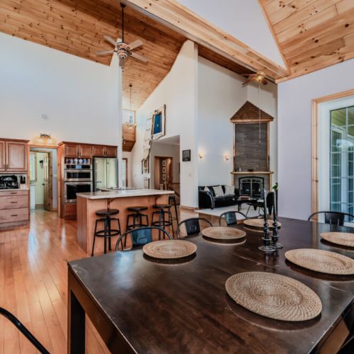 Spacious dining area with natural light and rustic charm—ideal for memorable vacation meals and cozy gatherings.