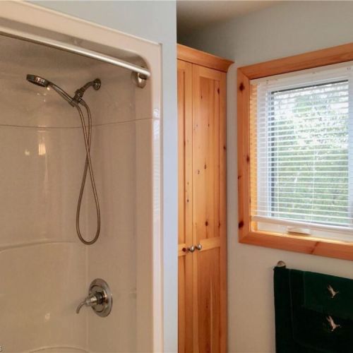 Freshen up in the walk-in shower, ideal after a day of swimming and outdoor adventures.