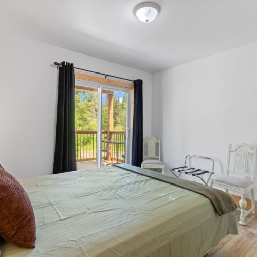 Wake up to peaceful forest views and step directly onto the private balcony.