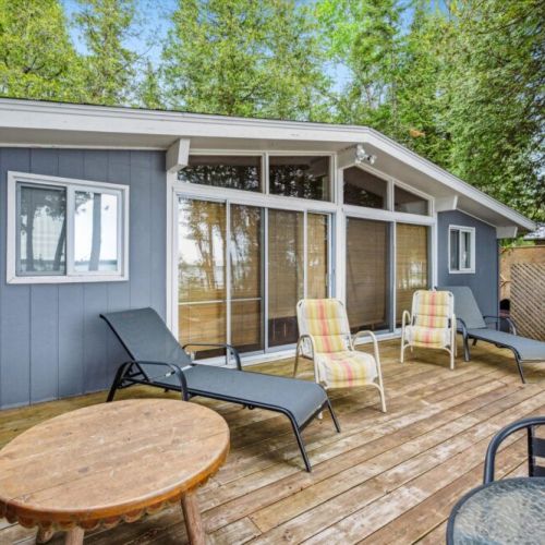Inside or out, you’re always close to the water. The open-concept living space spills onto the expansive deck, blending indoor comfort with outdoor bliss.