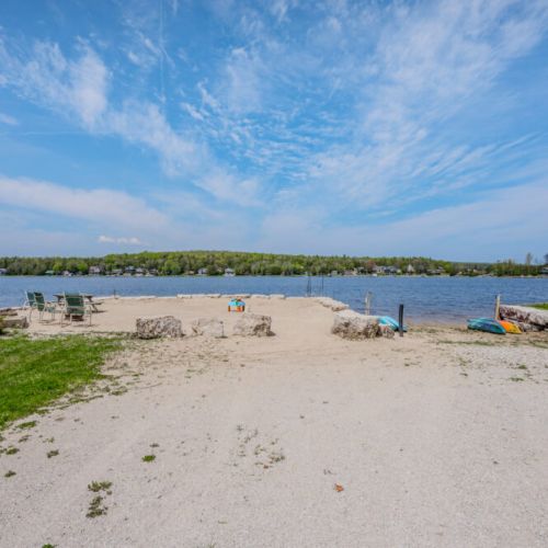 Your own personal slice of paradise, where the gentle breeze and the shores of Little Lake await your presence.