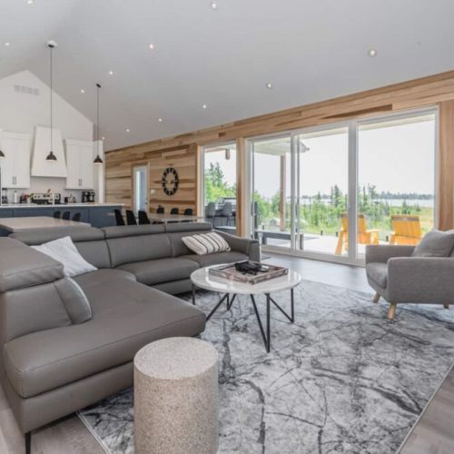 The Great room is large enough for any family, but understated and without pretense. Enjoy the incredibly comfortable De'Boer & Company sofas.