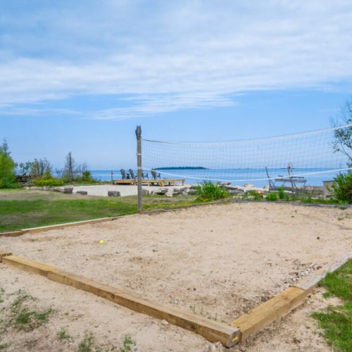 Enjoy a game of beach volleyball.