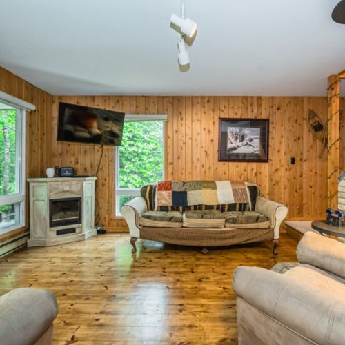 An airtight fireplace with television makes the living area a great place to entertain.