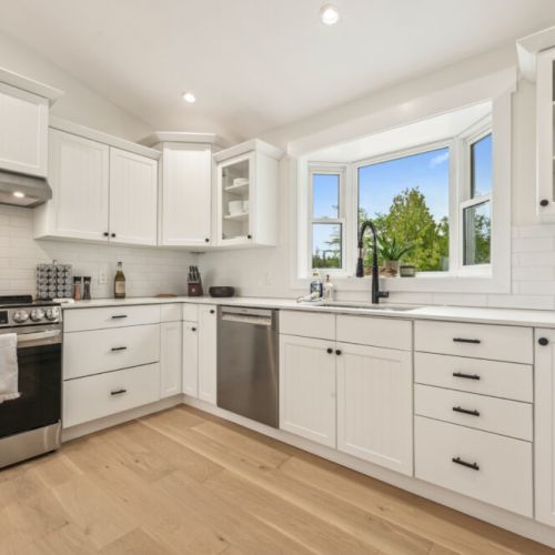 This bright, modern kitchen includes everything you need—stainless steel appliances, ample counter space, and a great view while you cook.