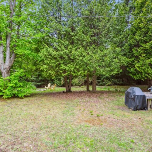 With a grill station, picnic table, and plenty of room for activities, the property offers multiple outdoor zones. It’s perfect for both quiet solo moments and lively group gatherings.