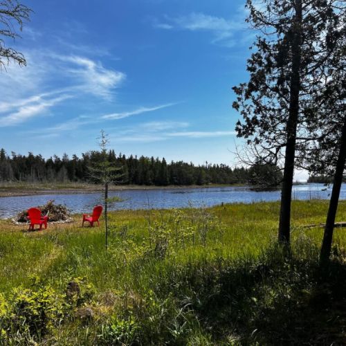 Waterfront seating area with beautiful views across Dorcas Bay, ideal for sunsets and quiet moments