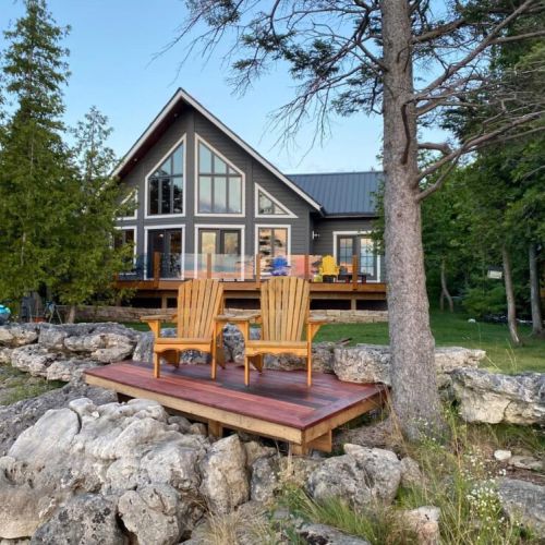 Enjoy the new waterside deck with Muskoka chairs.