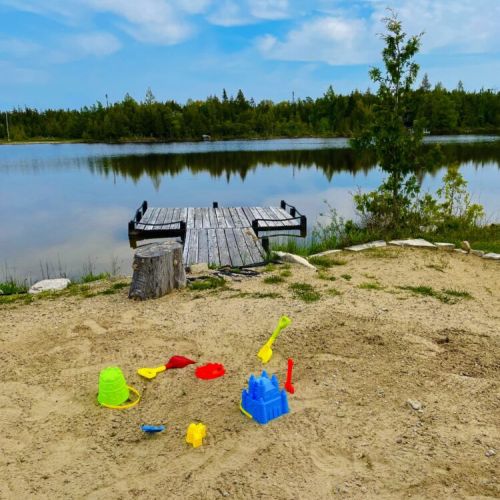 Sandy shoreline and calm waters—perfect for relaxing or family playtime