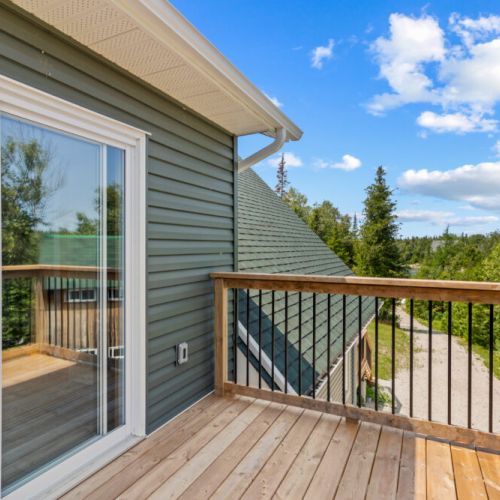 Step onto the private balcony and take in peaceful views of the surrounding forest.