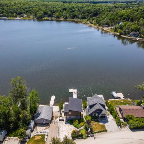 Bird’s-eye view of the property with direct access to the water and private dock.