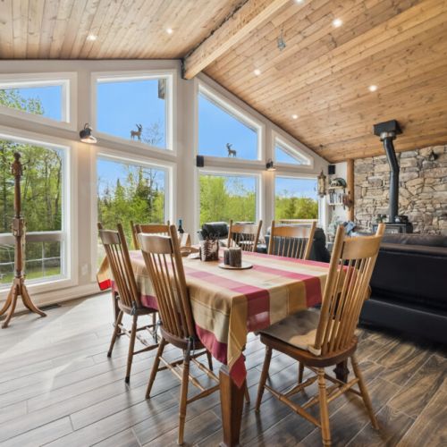 The dining area is open to the family room and connects seamlessly to the kitchen peninsula, providing comfortable seating for up to six people.