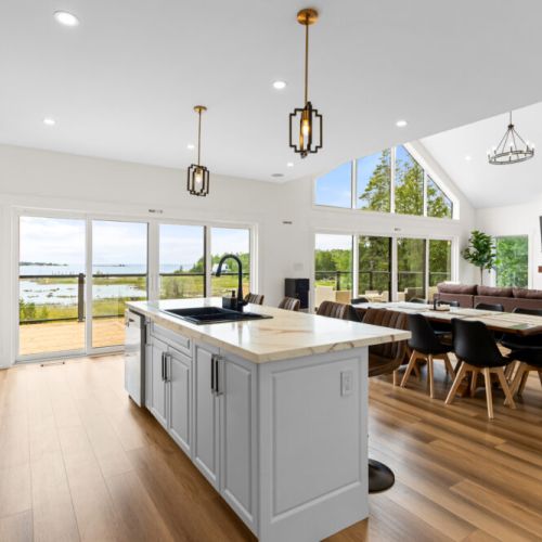 The open-concept kitchen and living space is designed for gathering with family and friends.