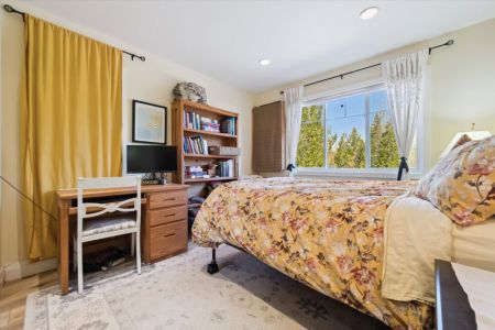 This comfortable bedroom also includes a dedicated workspace, making it easy to catch up on work or plan your next adventure.