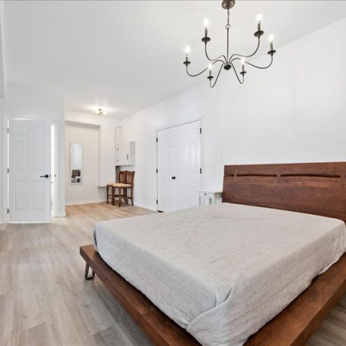 Bright and airy bedroom with a simple, modern design and plenty of space to settle in. Comfortable and calm—ideal for longer stays.