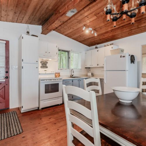 This full kitchen features everything you need, from vintage charm to modern appliances—perfect for extended stays or cottage cooking