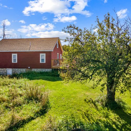 Mature apple trees add to the authentic country character and generations of history found throughout the property.