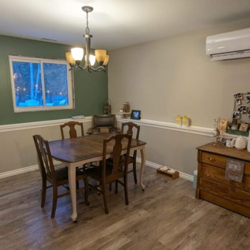 Bright dining space with seating for four, ideal for shared meals and morning coffee.