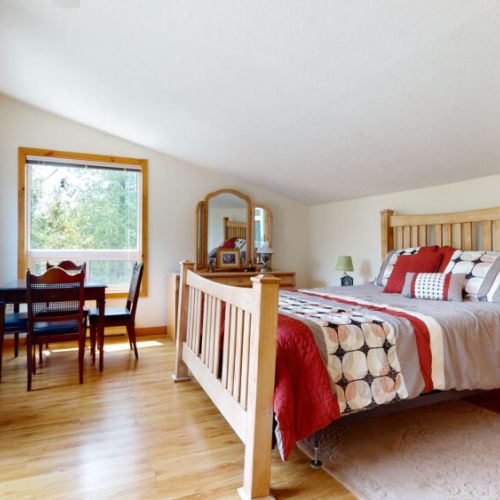 The Master bedroom features a dedicated work area perfect for that work Zoom call or enjoying the views.