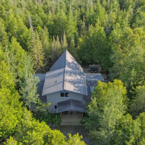Private retreat nestled in the trees — blending comfort, space, and rare privacy with proximity to Tobermory’s best sights.