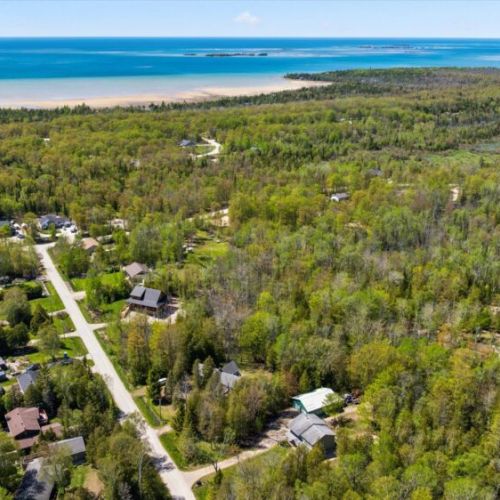 Experience the beauty of the Bruce Peninsula with Sauble Beach's famous sandy shoreline and crystal-clear waters just a short drive away.