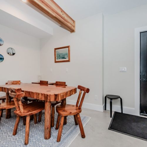 Dine in style with this handcrafted live-edge wood dining set, nestled in a bright and inviting area of the vacation rental — perfect for shared meals and making memories during your nature getaway