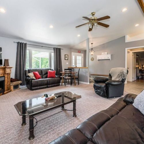 The luxurious leather sofas are ready for you to sprawl out on. Enjoy the ambient fireplace with a fabulous view of the West lawn.