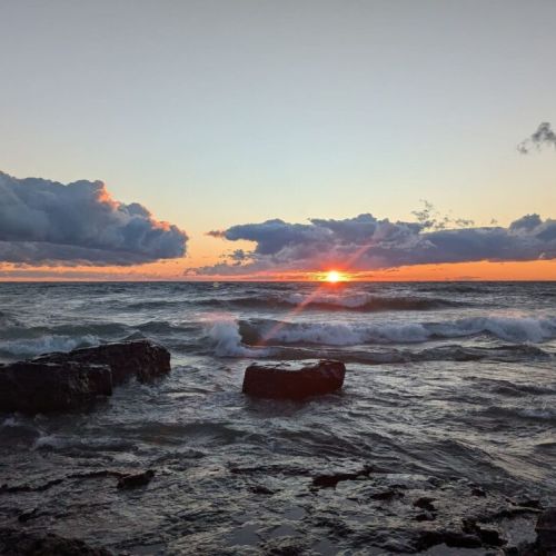 Capture breathtaking Lake Huron sunsets with dramatic skies and crashing waves—an unforgettable evening ritual just steps from your door.