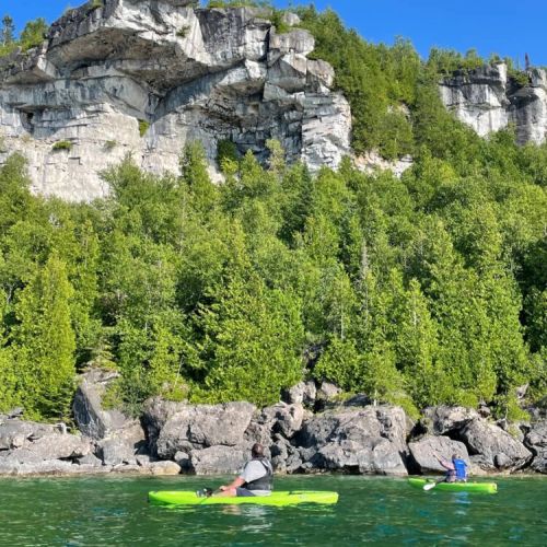Explore the dramatic limestone cliffs and crystal-clear waters of Isthmus Bay by kayak. A favourite local adventure and one of the best ways to experience the Bruce Peninsula's rugged shoreline.