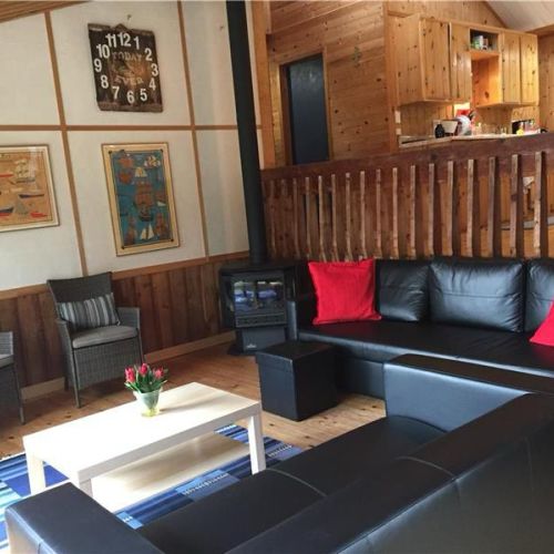 Comfortable living room with cozy seating and a relaxed cottage atmosphere.