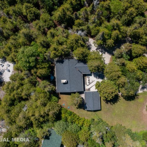 Bird’s-eye look at Breezy Woods tucked into the forest canopy for total privacy and calm.
