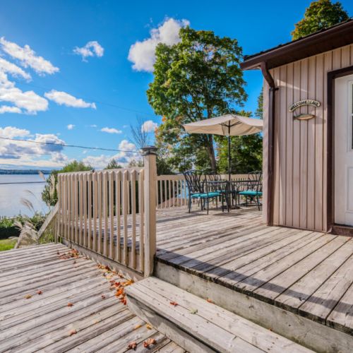 Enjoy dining or lounging on the spacious deck with breathtaking views of Georgian Bay—perfect for relaxing afternoons or morning coffee.