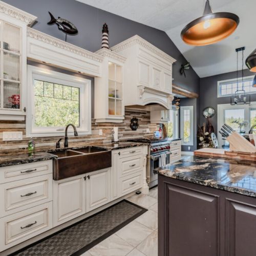 Enjoy gourmet cooking in this stunning vacation rental kitchen, featuring granite counters, high-end appliances, and panoramic views—perfect for culinary getaways or cozy cottage escapes.
