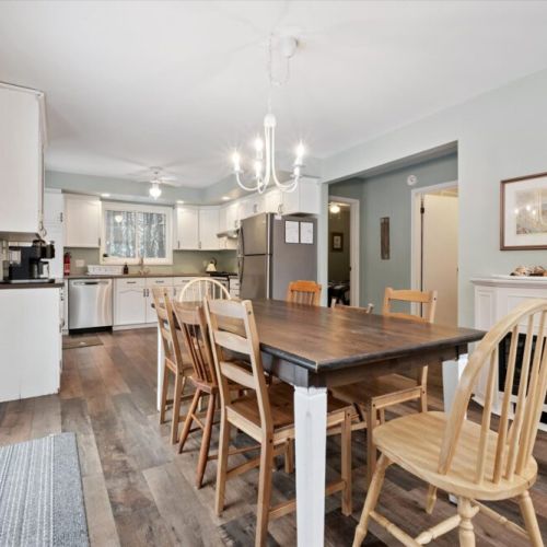 Spacious dining area with seating for the whole group, open to kitchen and living space
