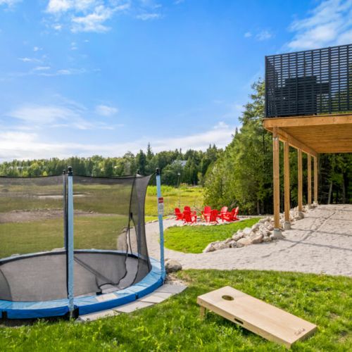 Enjoy endless outdoor fun with a trampoline, cornhole, and plenty of space to play.