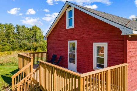 The new wraparound-style deck adds even more outdoor space to relax and take in the peaceful surroundings.