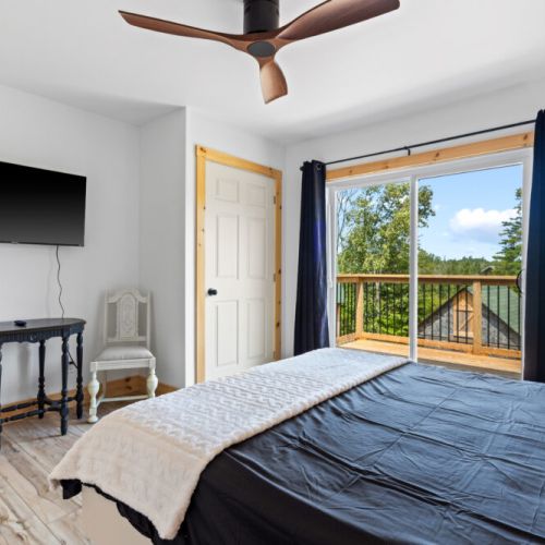 Enjoy your morning coffee or evening breeze from the private balcony just outside the bedroom.
