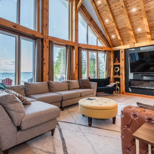 Massive cathedral ceilings enclose the beautiful floor-to-ceiling views of Lake Huron.