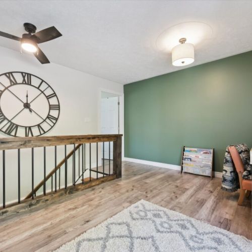 Quiet sitting area with sliding doors leading to the outdoor deck — perfect for morning coffee or relaxing with a book.