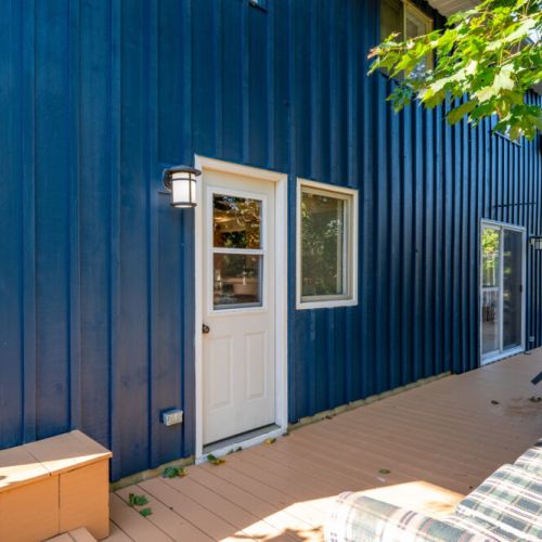 This back entrance offers easy access to the outdoor areas, blending rustic charm with modern convenience.